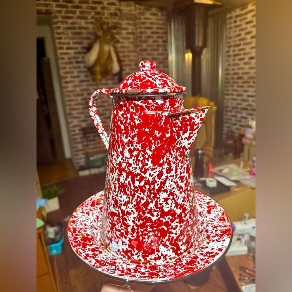 Rustic vintage porcelain over metal plate and pot with lid.